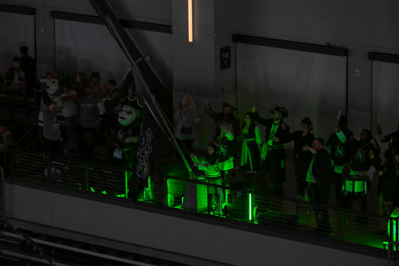 Ghost Pirates mascot waving a flag from the upper level during the All-Star Classic