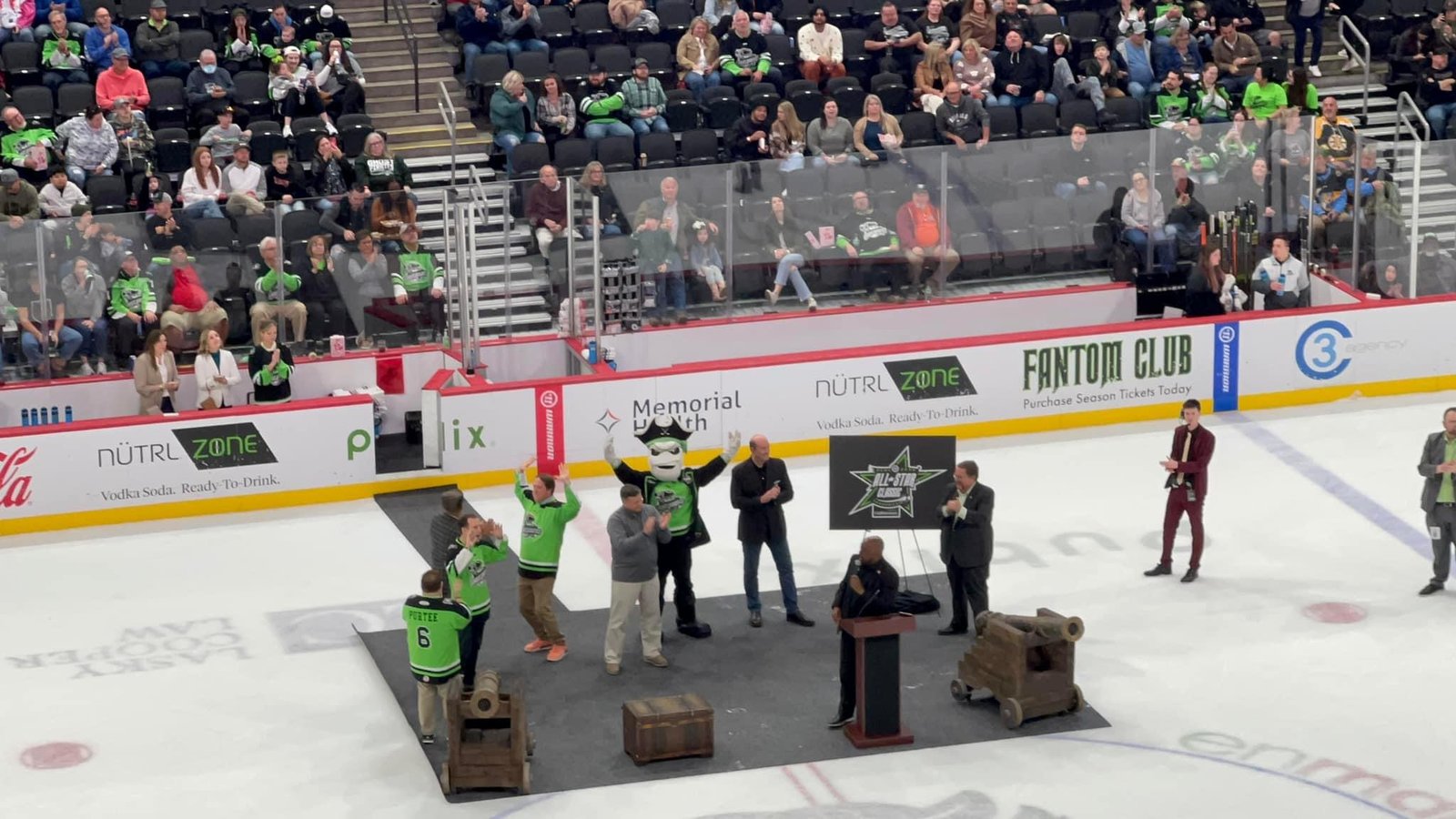 Ghost Pirates mascot and dignitaries on stage for the All-Star Classic announcement