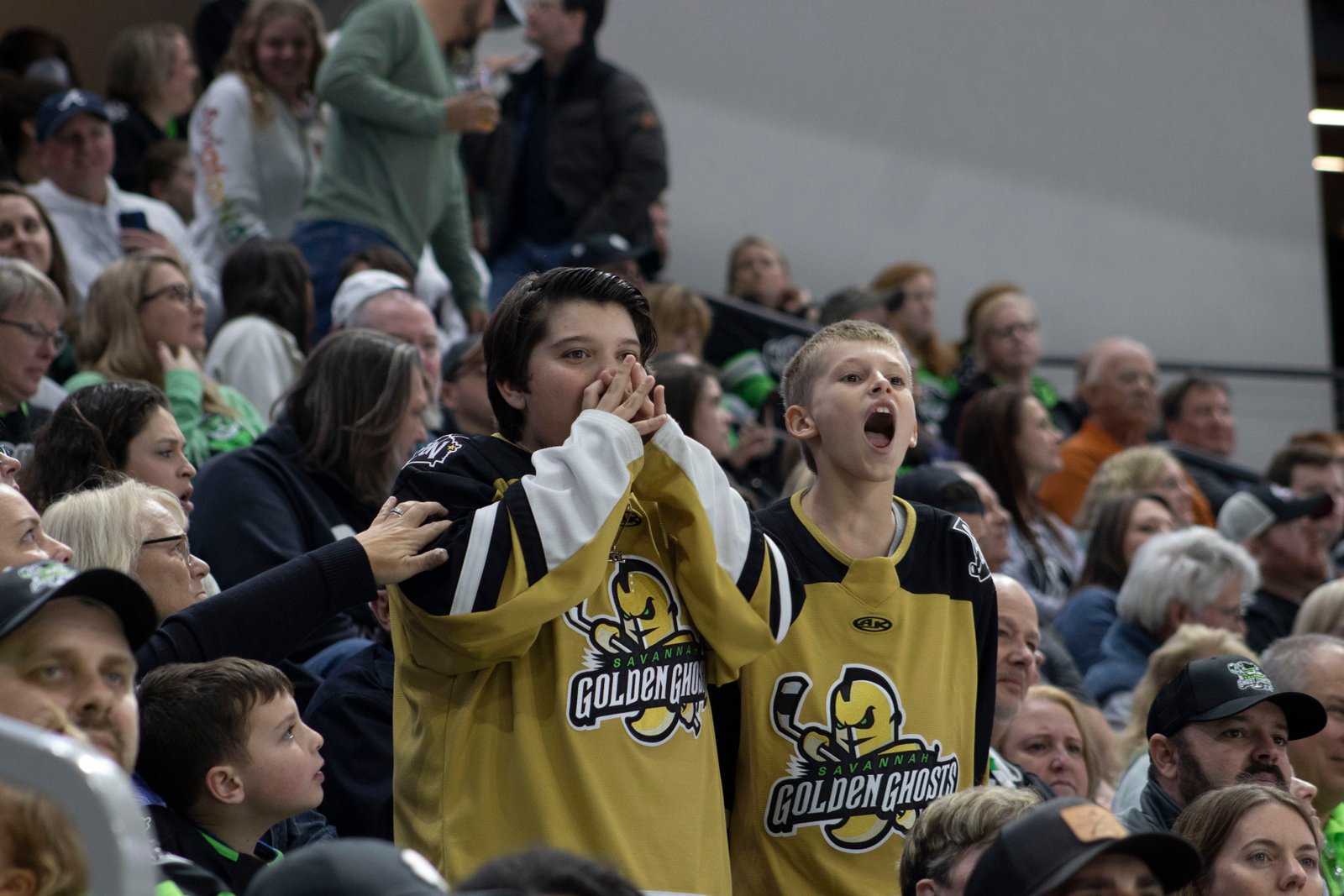 Golden Ghosts drum line member performing on the ice